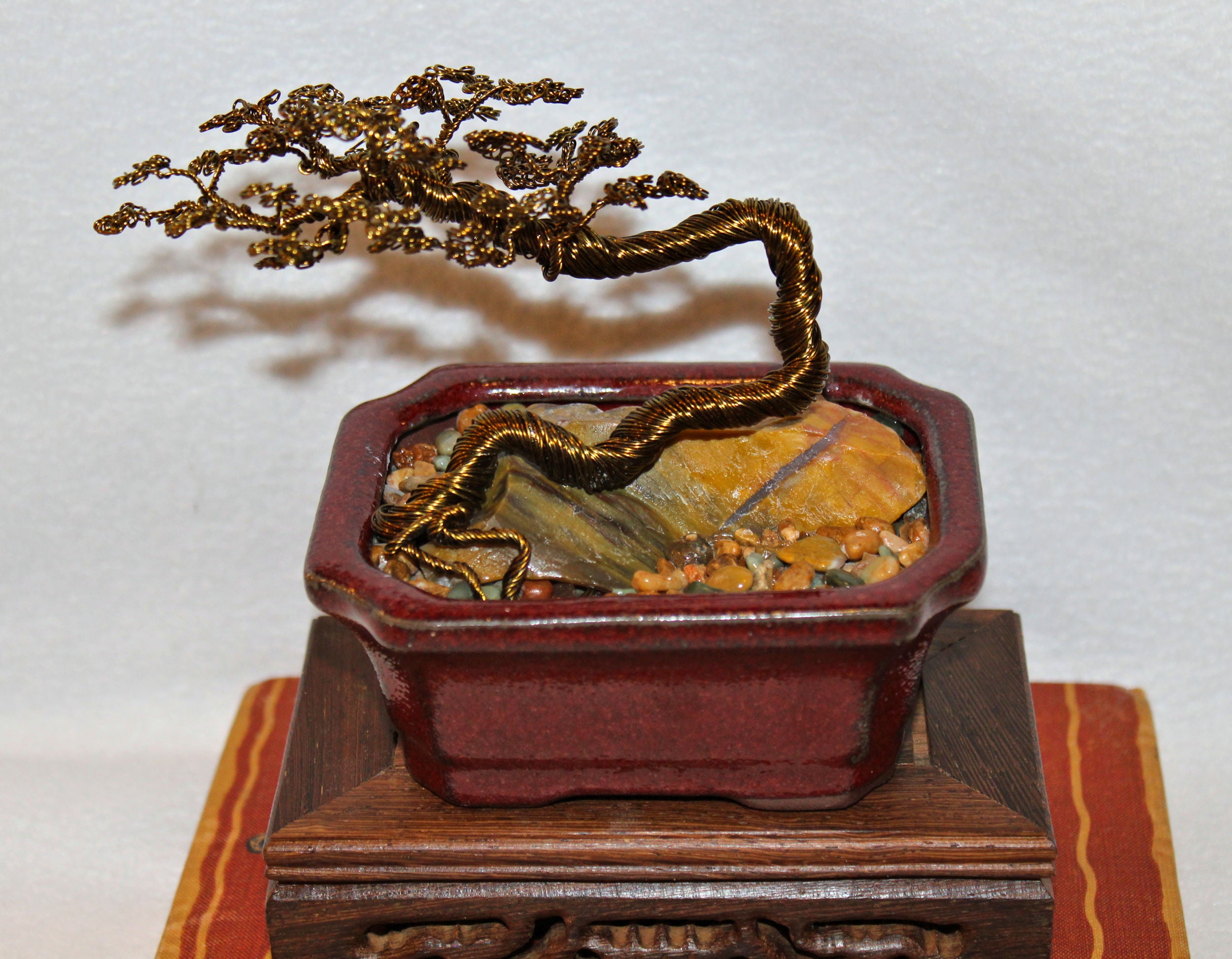 literati bonsai trees Windswept Literati Bonsai over Large Raw Petrified Wood
